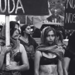 grayscale photography of women marching